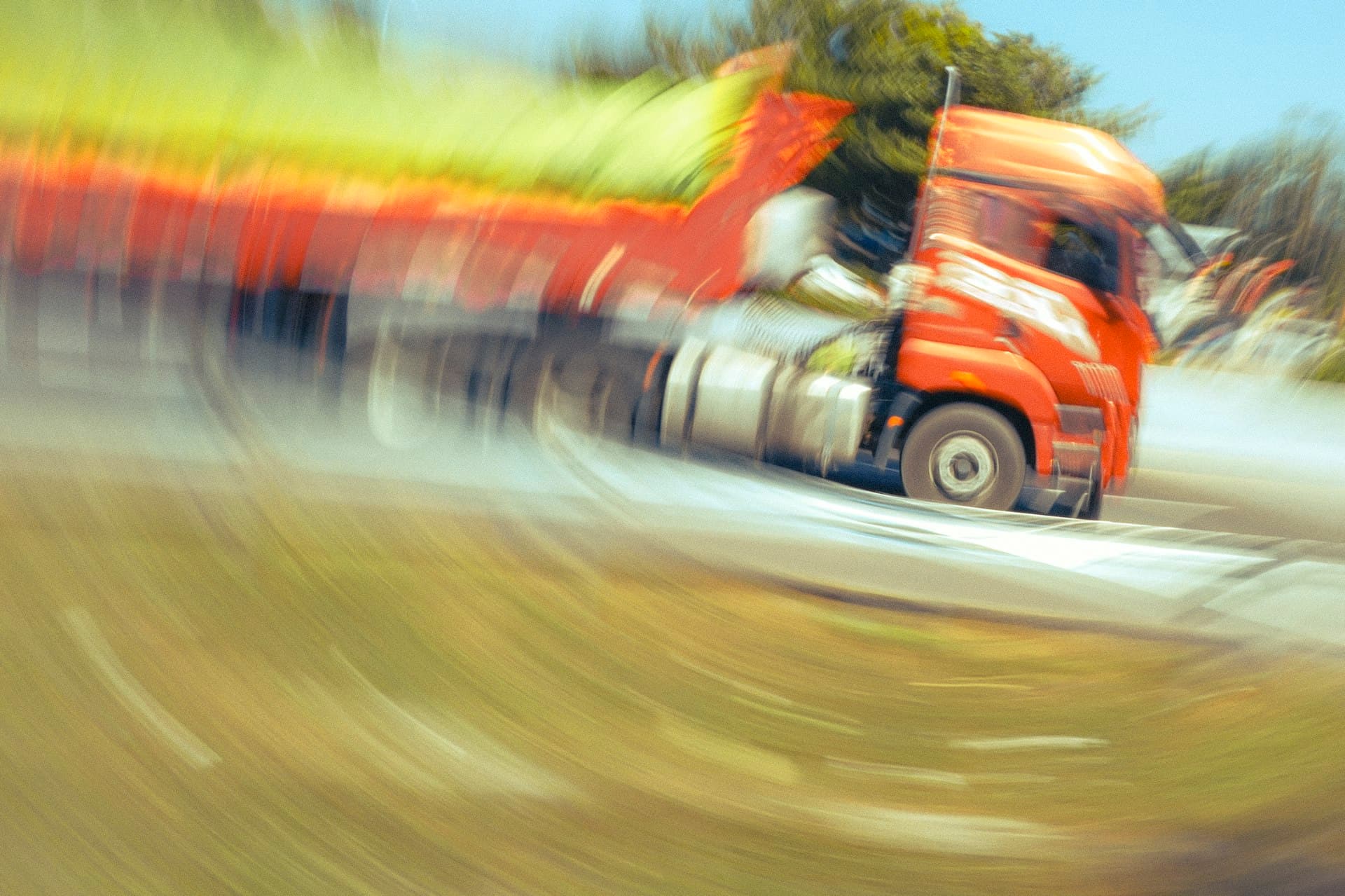 Semi truck at speed on a highway with motion blur